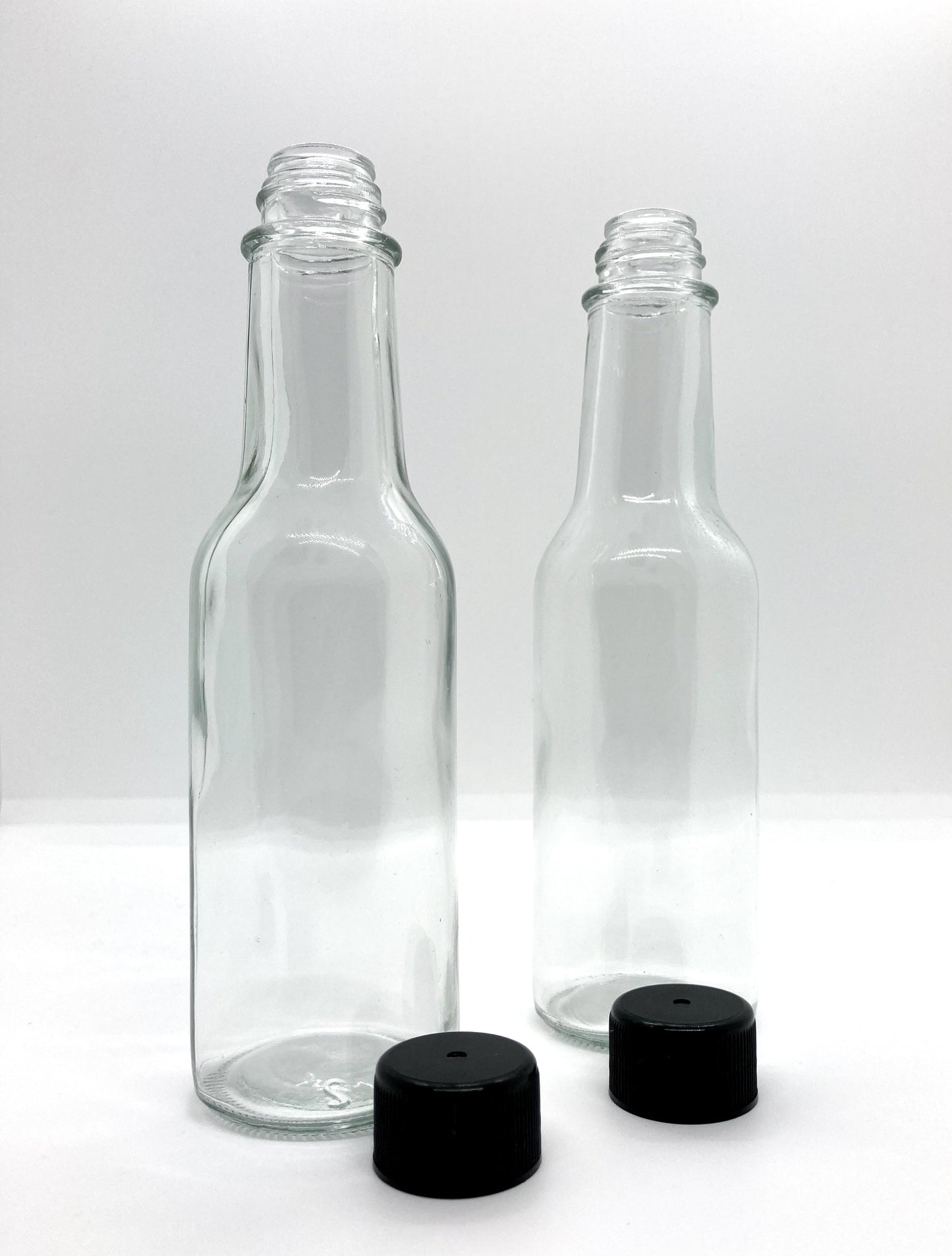 150mL. (Woozy Bottle) Clear Round Glass Bottle with Black Cap